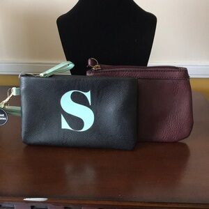 Two wristlets! Colors: black and burgundy!